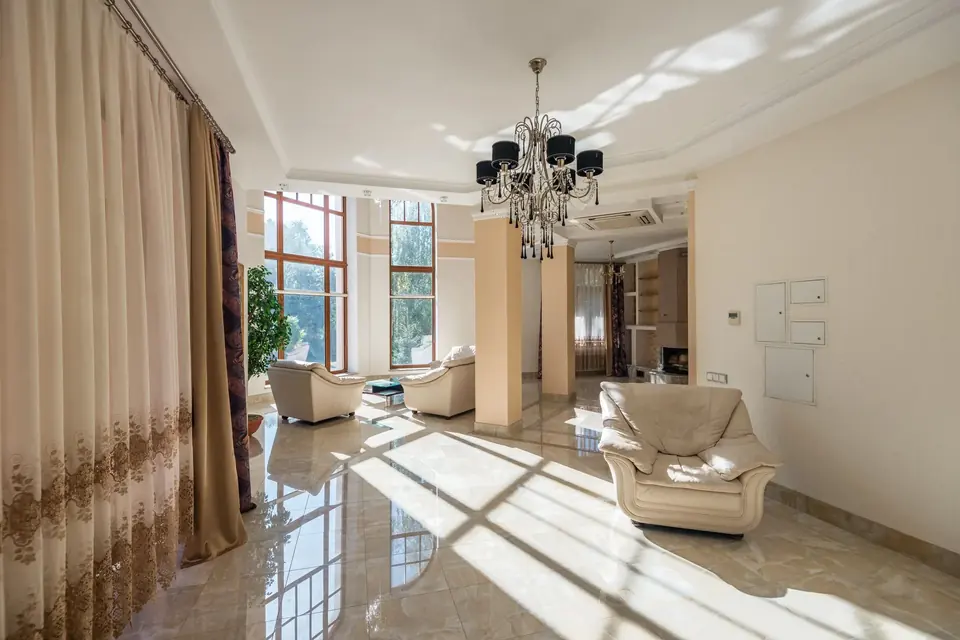 Luxury curtains framing large glass windows in a hallway