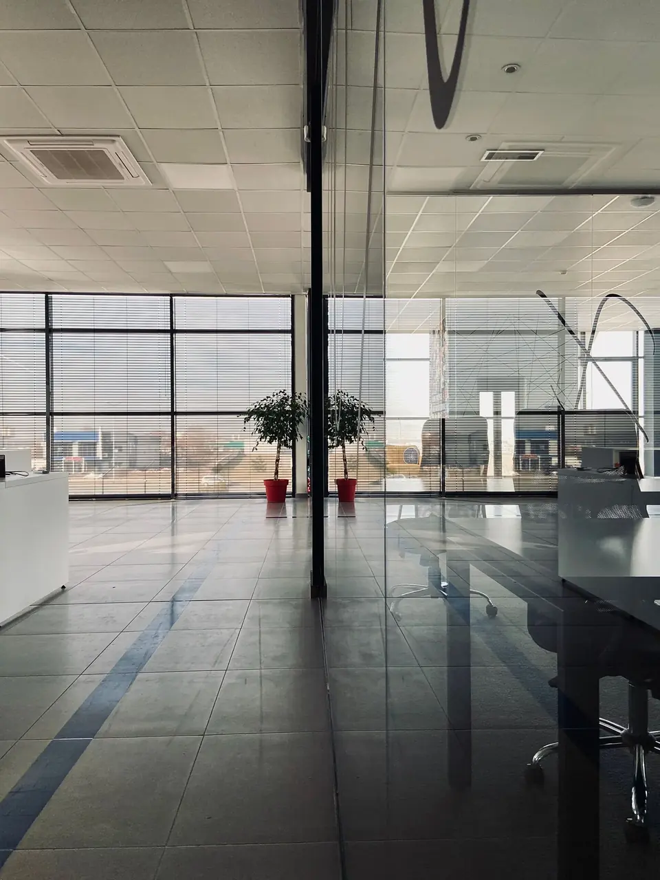 Panoramic glass walls in a bright modern office