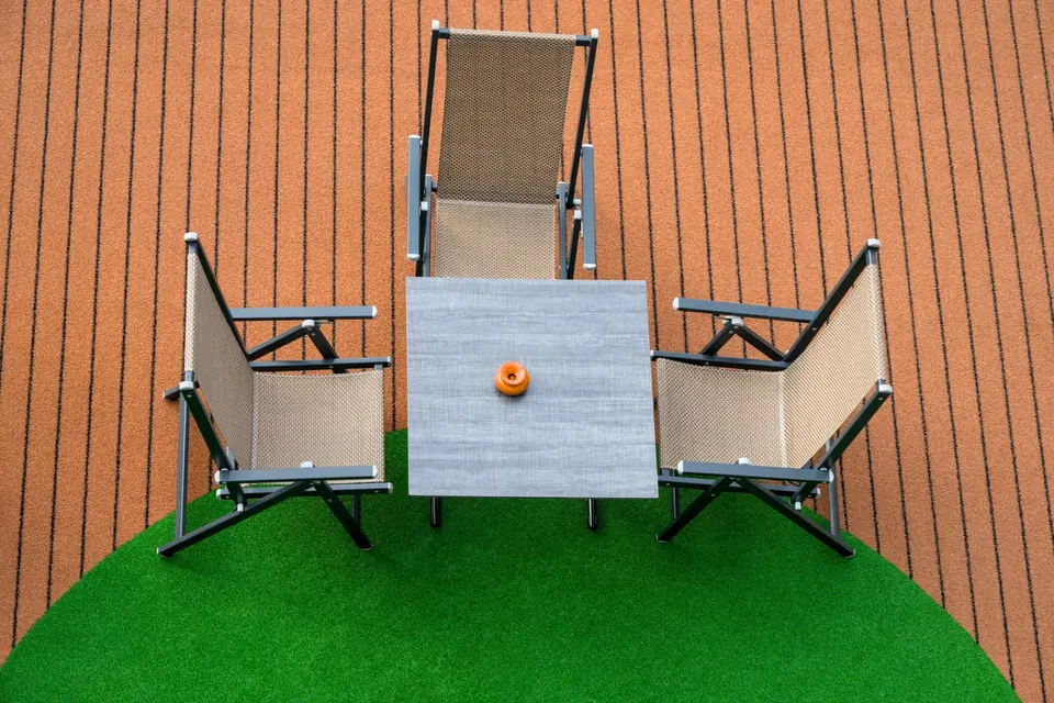 Patio furniture set on a lawn of artificial grass