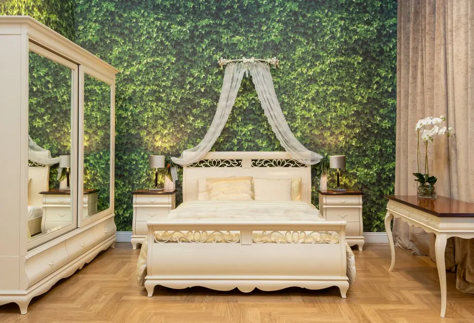 Sophisticated bedroom with a lush green accent wall and elegant furniture